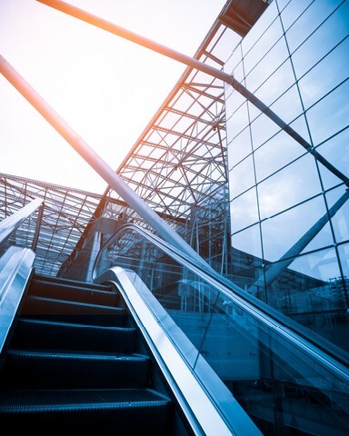 Escalator with passengers motion blur